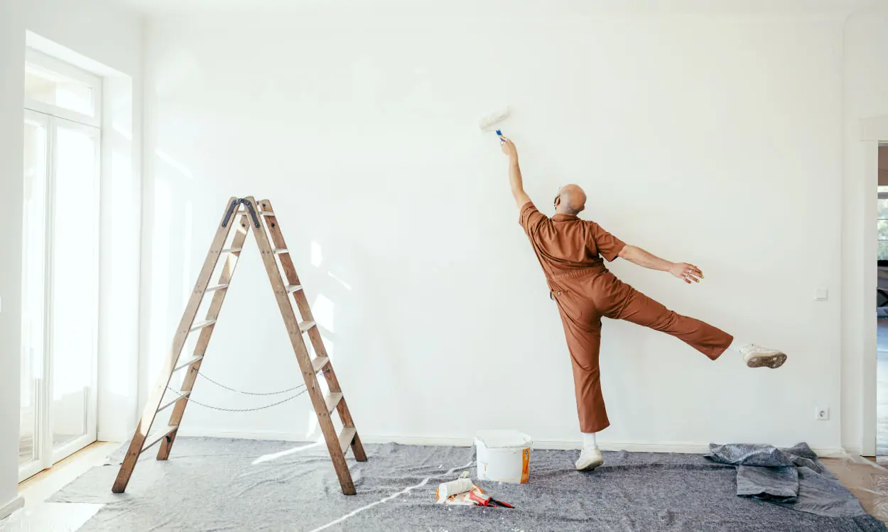 Professional painter working indoors — Prestige Painting Kelowna